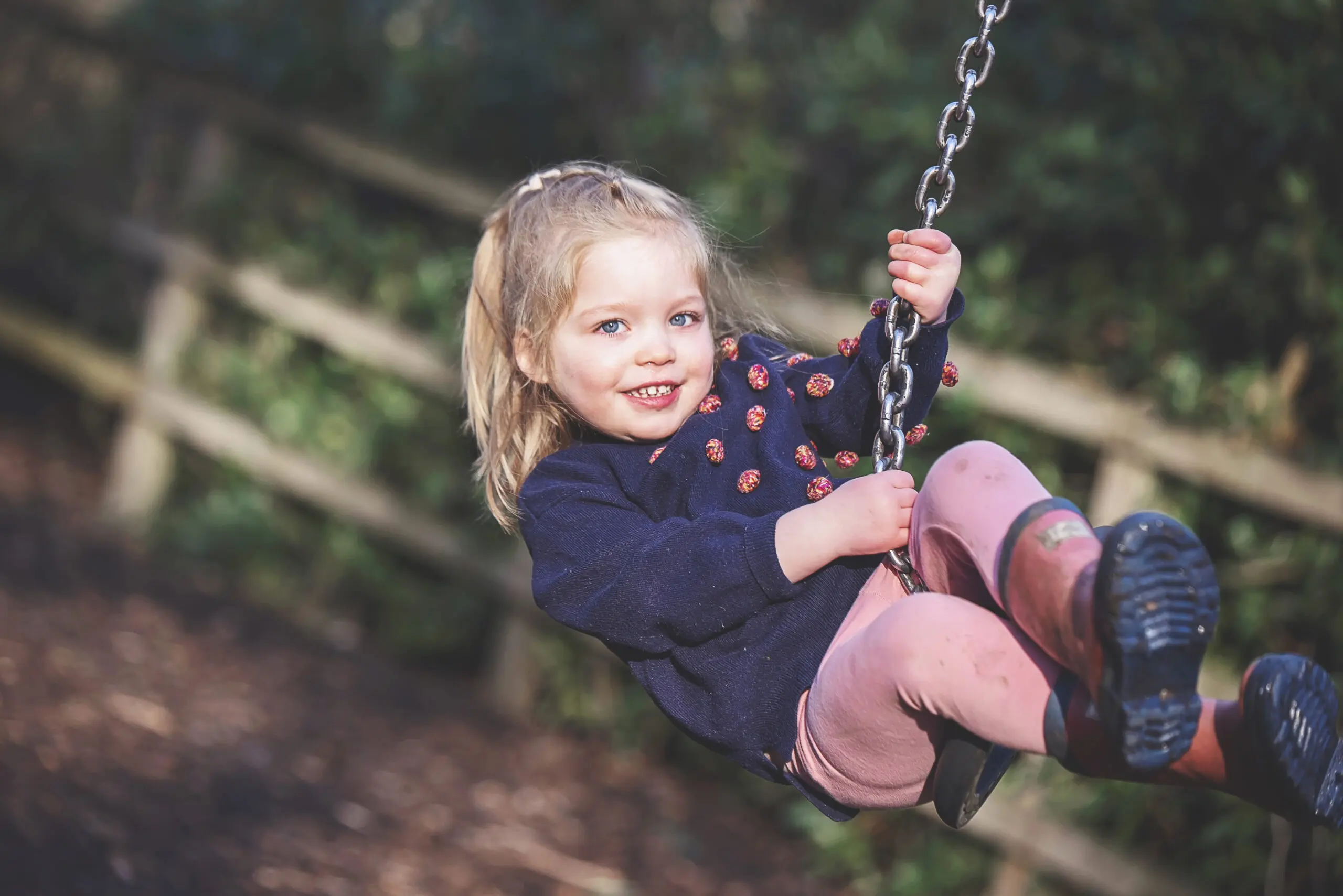 Children on a swing in the adventure playground